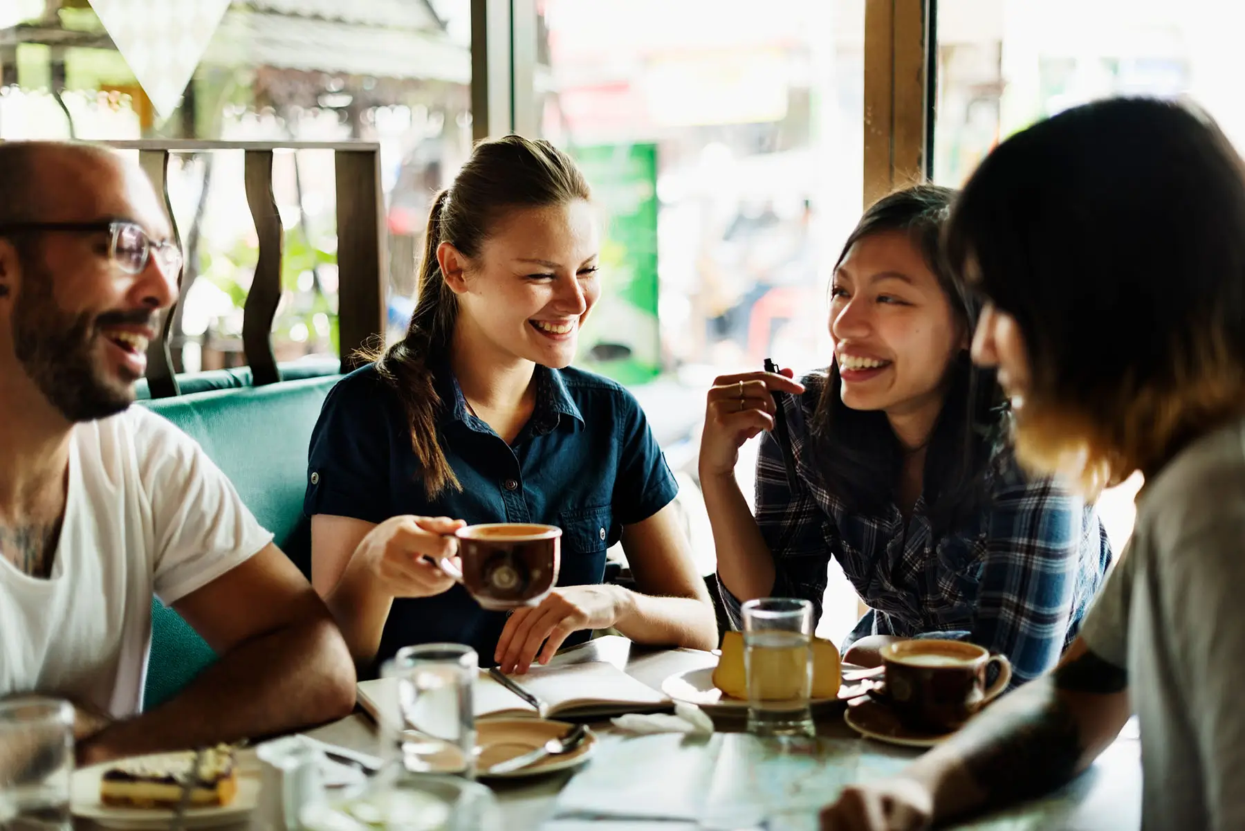 Colleagues sharing coffee in a professional workplace lounge